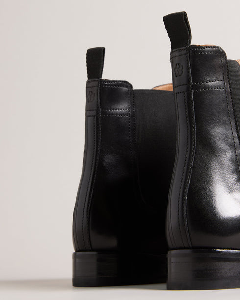 MAISONN-Boots-Step into pure luxury in leather and cotton. MAISONN are a stylish and versatile pair of chelsea boots with timeless appeal. These boots offer a sharp accent to any outfit and are finished with a subtle debossed magnolia on the heel. By purchasing this product, you are supporting responsible leather manufacturing through the Leather Working Group Chelsea boots Leather Pull tab Fully lined Closed round toe Elasticated ankle panel Ted Baker branded- Ted Baker Romania